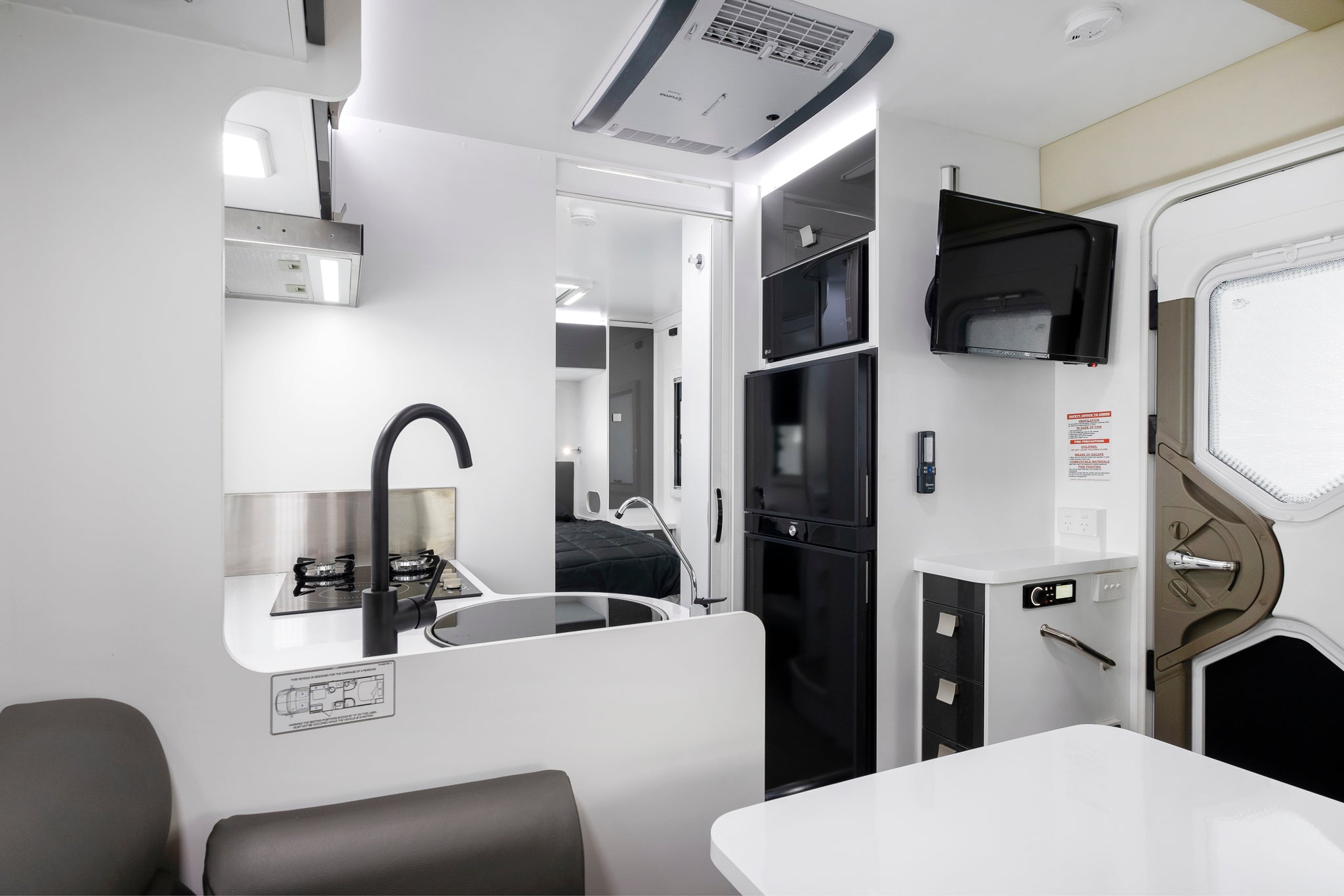 Iluka interior view of kitchen and exit door