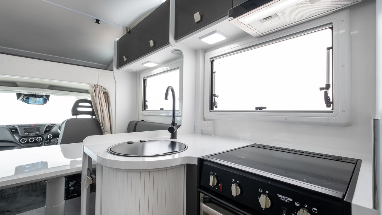 Winnebago Iluka interior view of oven and drivers area