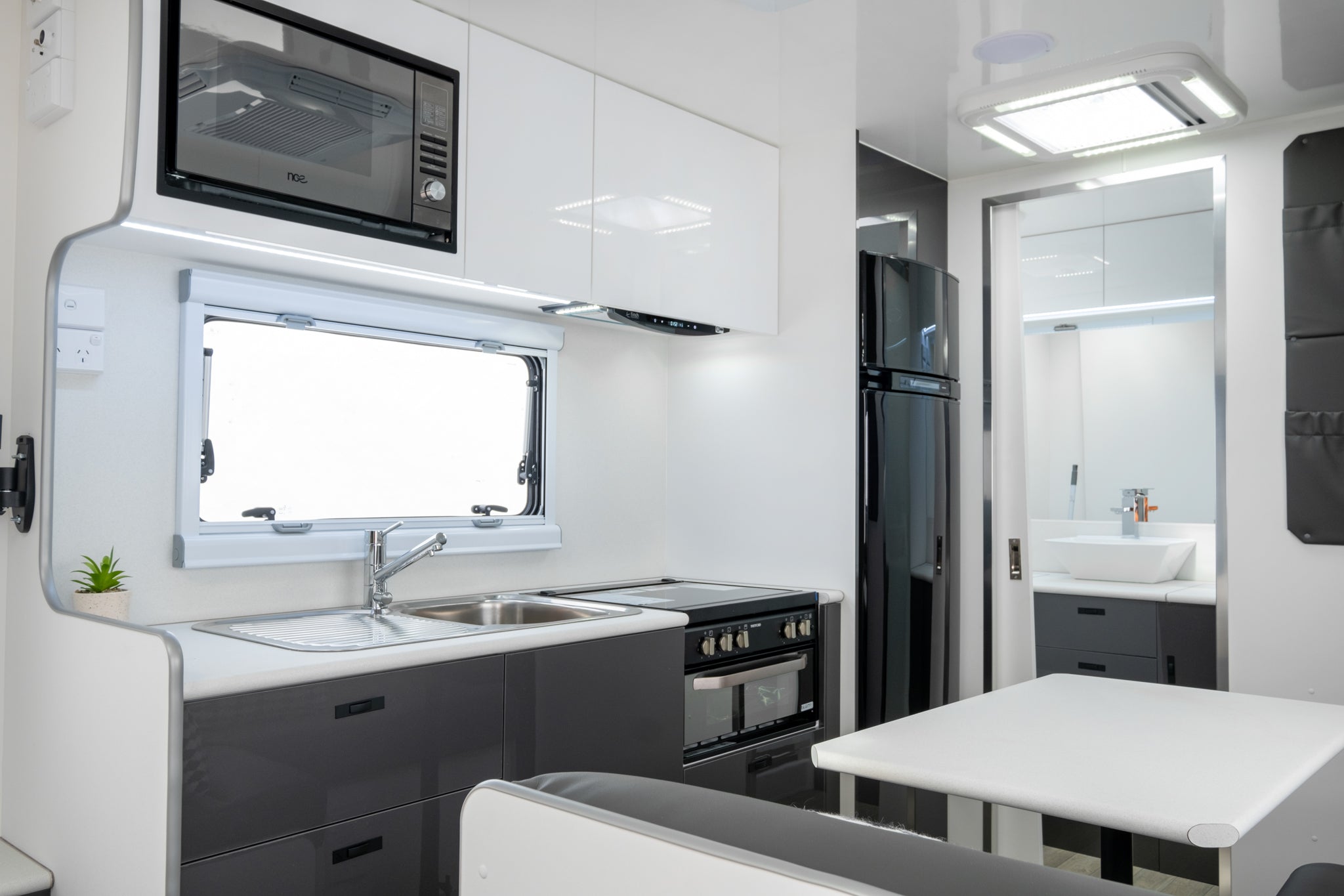 Coromal Thrill Seeker 18 Couples caravan microwave, kitchen, fridge and bathroom view