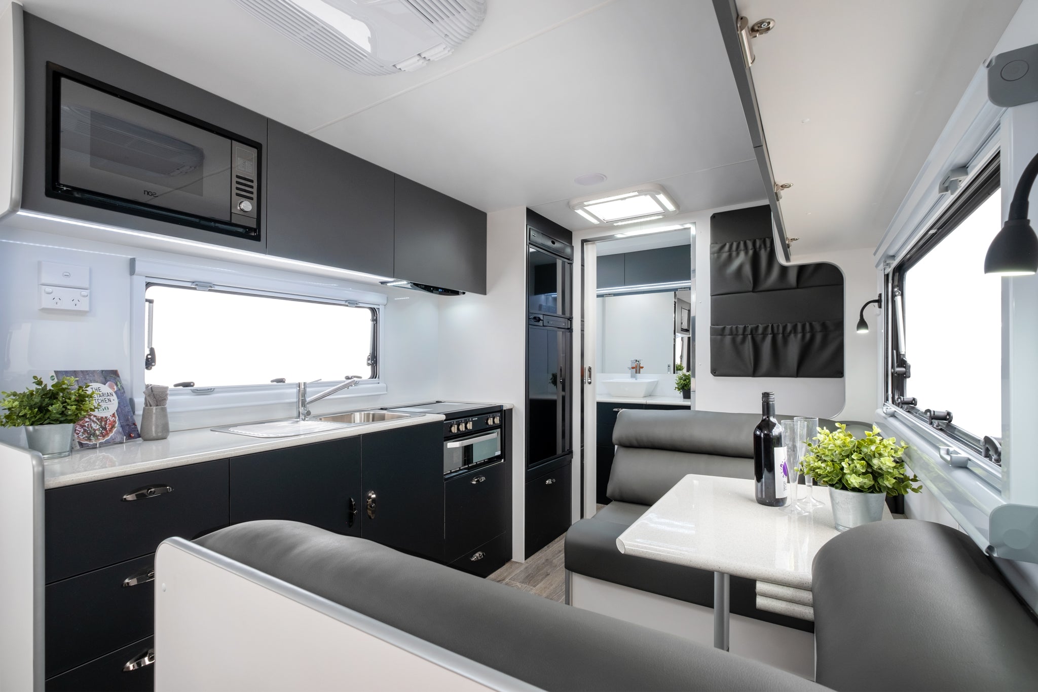 Coromal Thrill Seeker 19'6 Couples interior kitchen and seating area