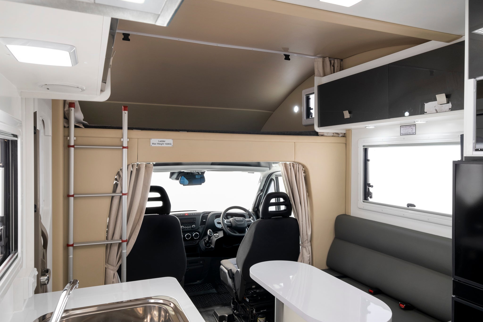 Winnebago Coogee motorhome dining and over cab bed