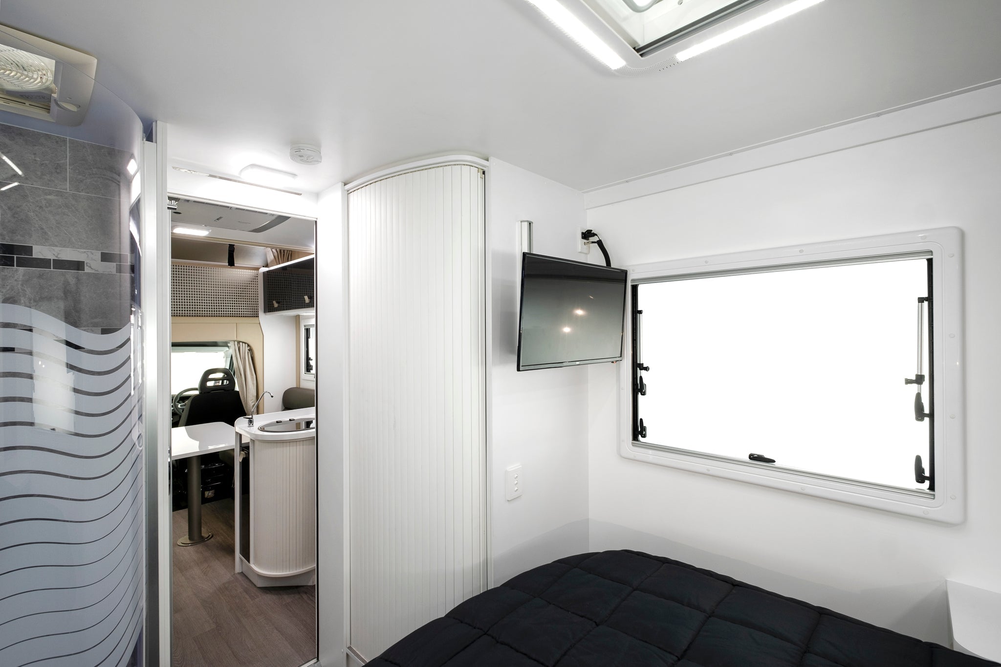 Winnebago Iluka Bedroom with television and shower