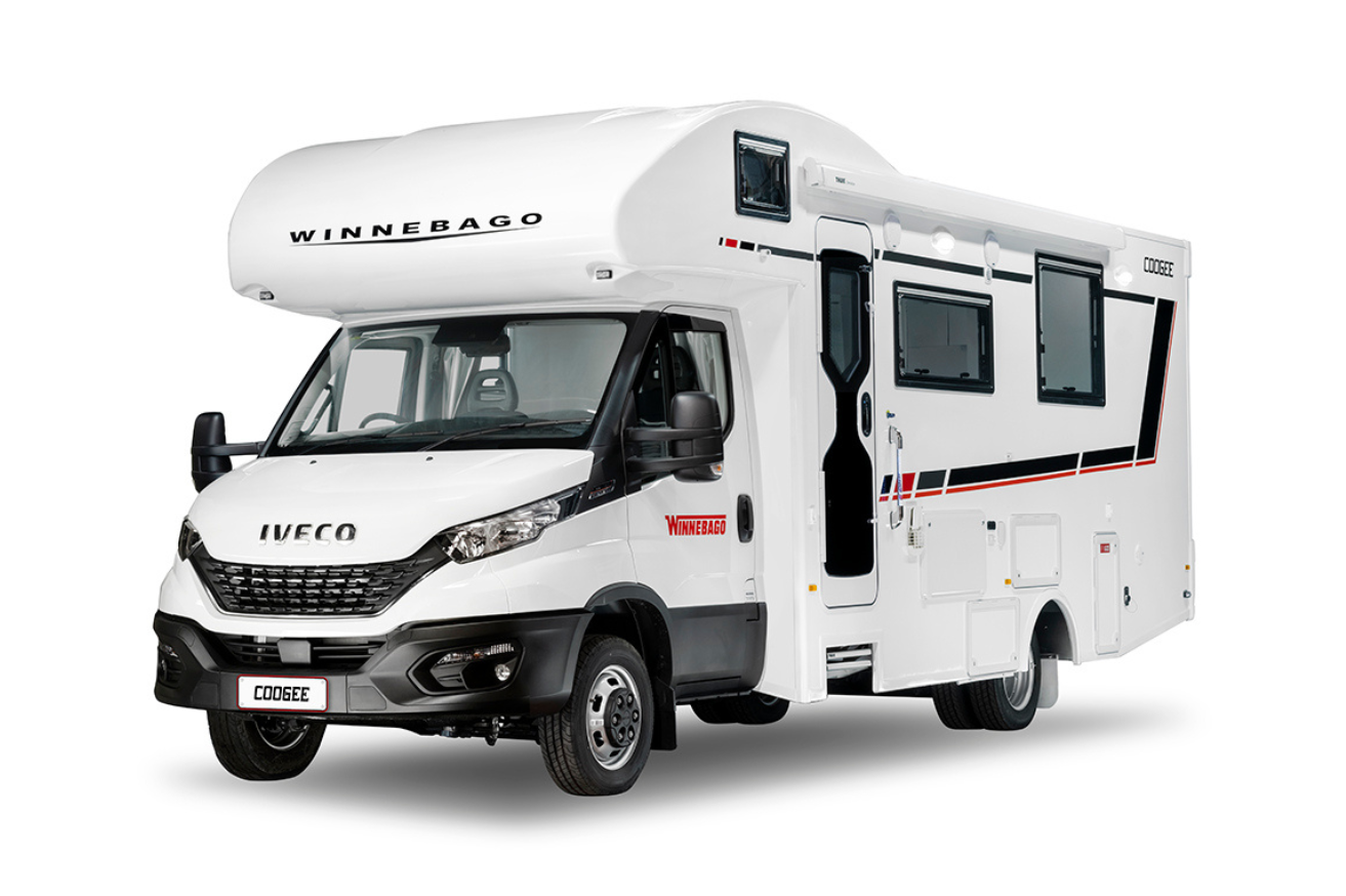 A white Winnebago Coogee motorhome with an electric slide-out bed, based on the IVECO chassis, designed for four passengers and sleeping quarters.