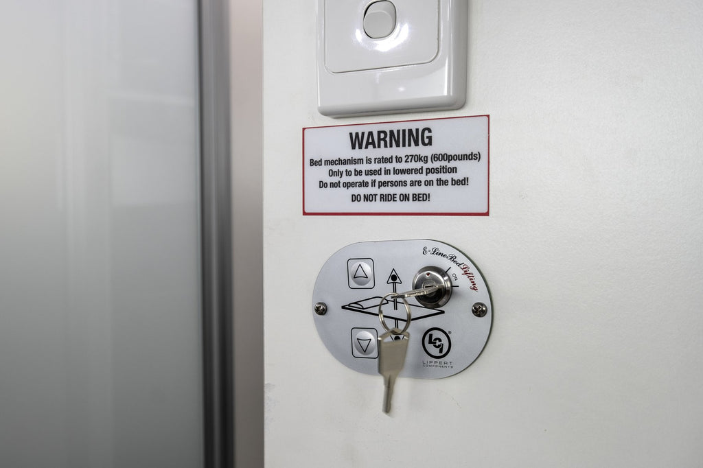 rv drop down bed key and control panel