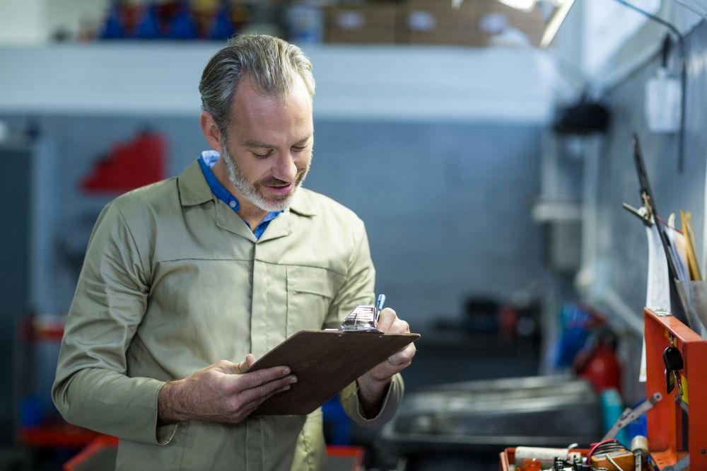 man with clipboard check warranty